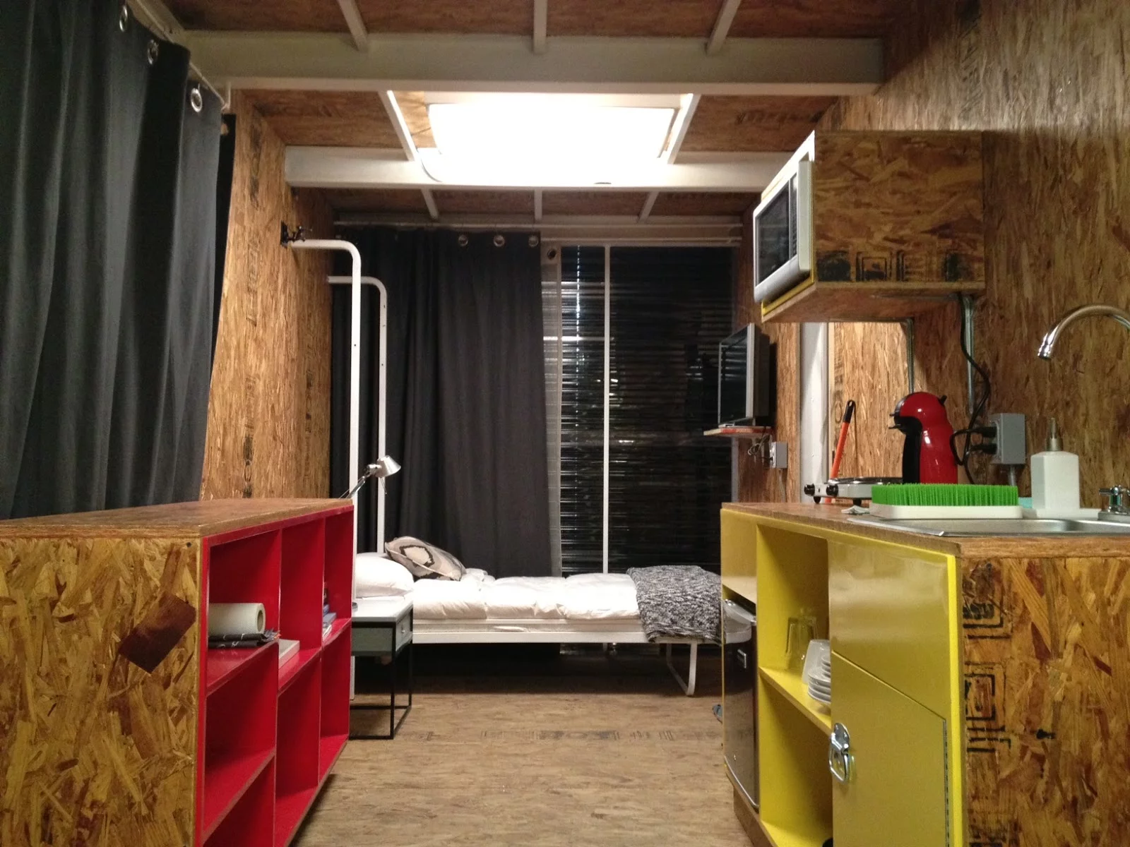 Altogether, the main living area only covers 16 square meters (about 172 square feet) and includes room for a kitchen, dressing room, closet, bathroom, shower, and work desk