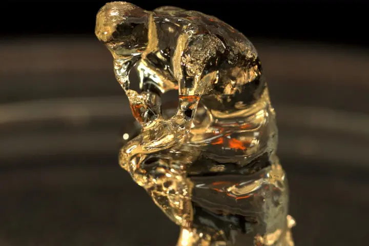 A miniature version of the statue "The Thinker," created using the new 3D-printing system