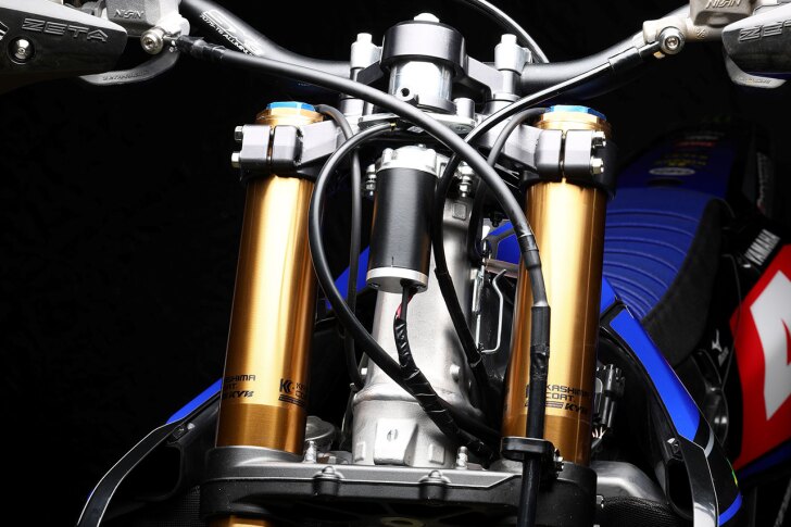 Yamaha's compact electronic power steering system prototype bolts to the top triple clamp
