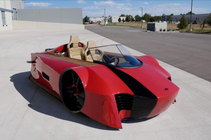 See those seats? They're the luxury part. The sports part is the directional control system, and the red paint
