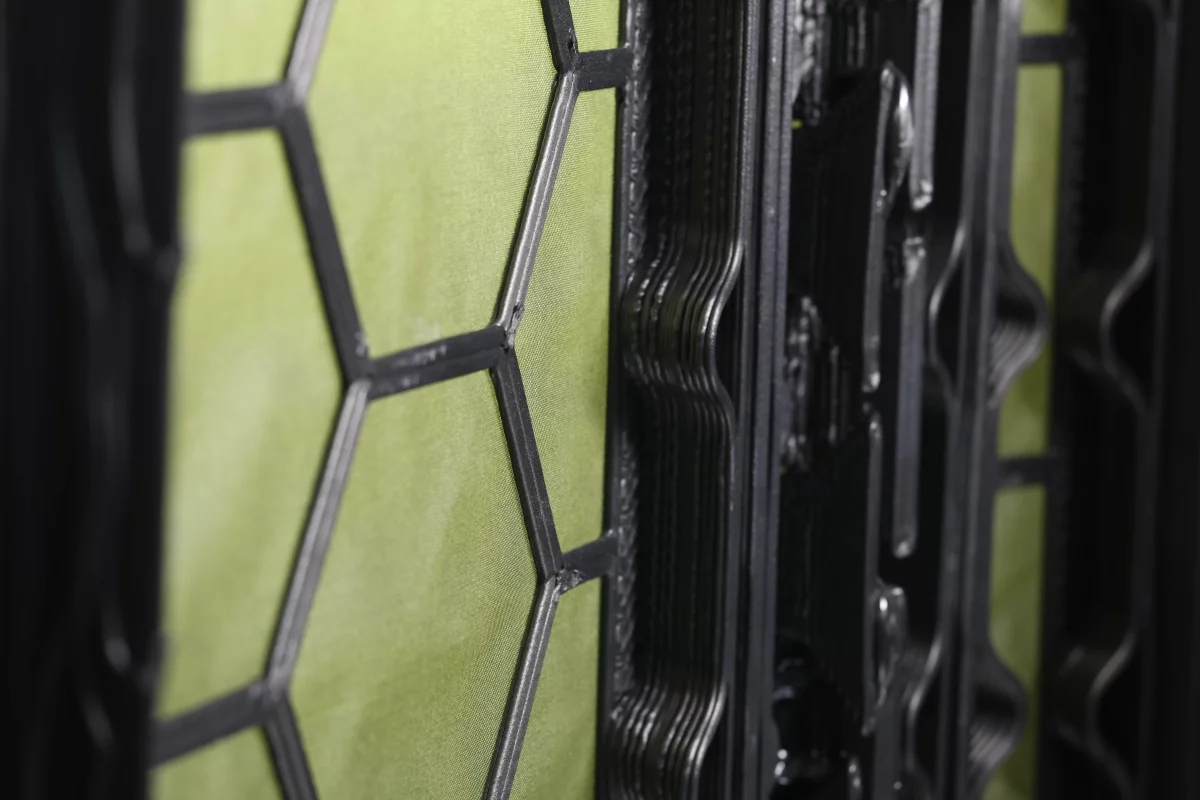 Each panel consists of the fabric base (green) and the 3D-printed structural grid (black)