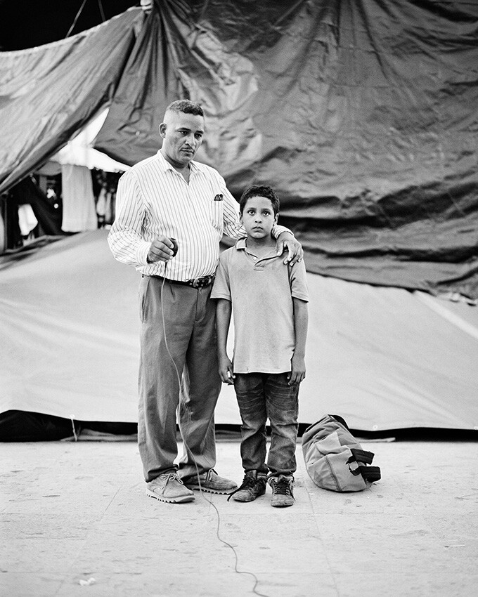 "To capture a piece of this uncertain journey, I mounted a medium format camera on a tripod with a cable release and then stepped back, allowing the migrants to choose the moment of capture and give them agency in the process of documenting their lives".