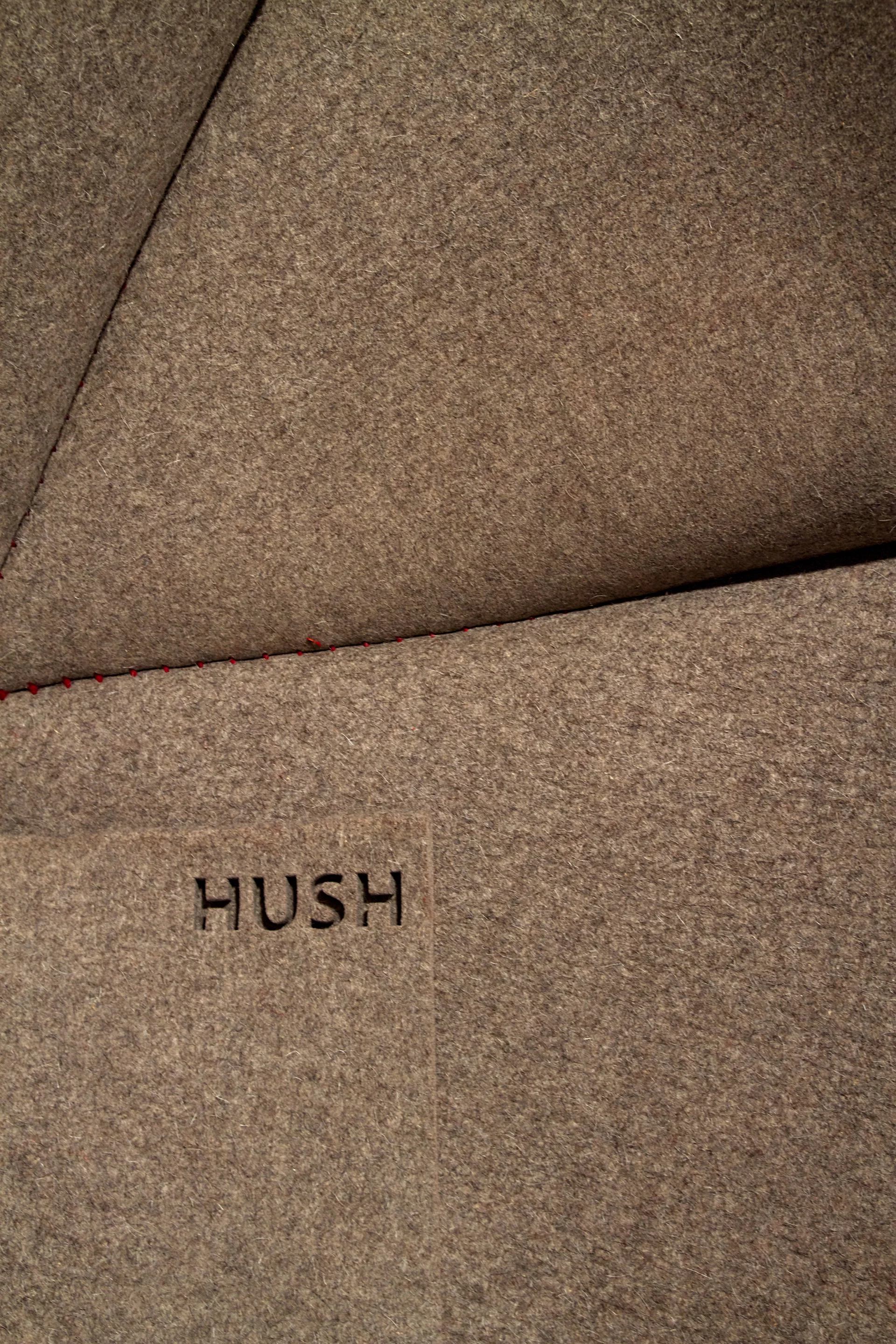 Made from a single piece of water jet-cut 12-mm thick (0.5-in) industrial felt 1750 x 4000 mm (69 x 157 in) in size, HUSH is sewn by hand with 150 meters (490 feet) of wool yarn