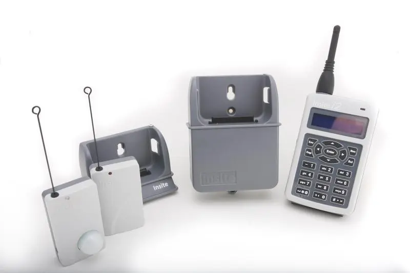 The Insite PGAMS i2 base unit, docking station, and wireless transmitters