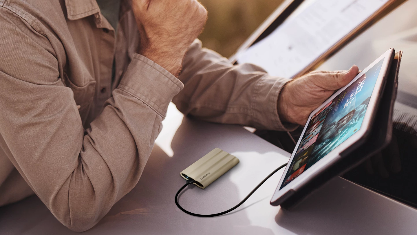 The T7 Shield portable SSD is available in 1 TB or 2 TB storage capacities, and is reported compatible with numerous devices including PCs, Android smartphones and tablets and games consoles