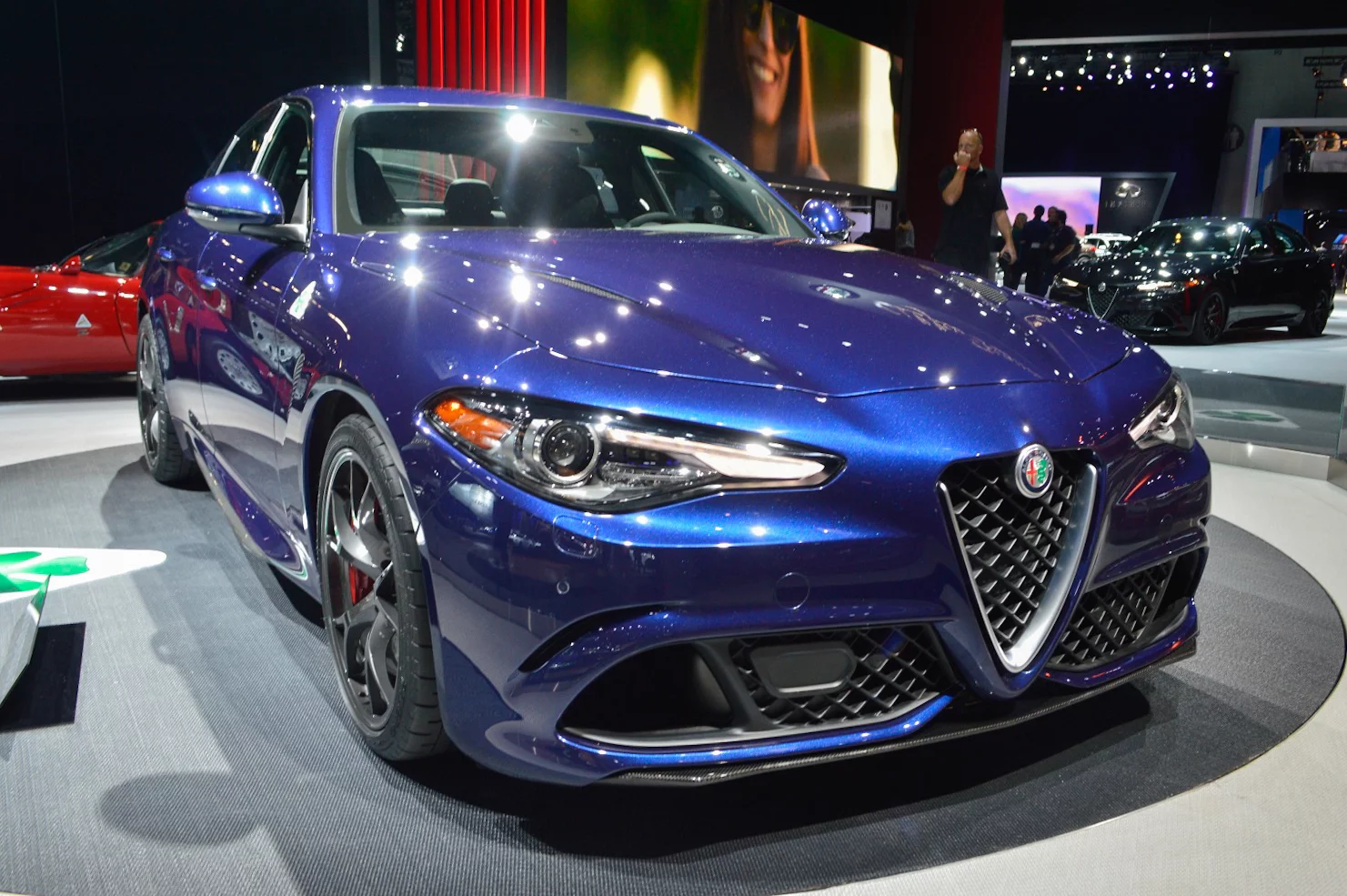 Slitted headlights look out from the corners over air scoops that forego bezels in favor of body shaping edgework