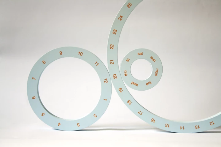 ONE: multi-ringed calendar and magnetic designer corporate play-thing
