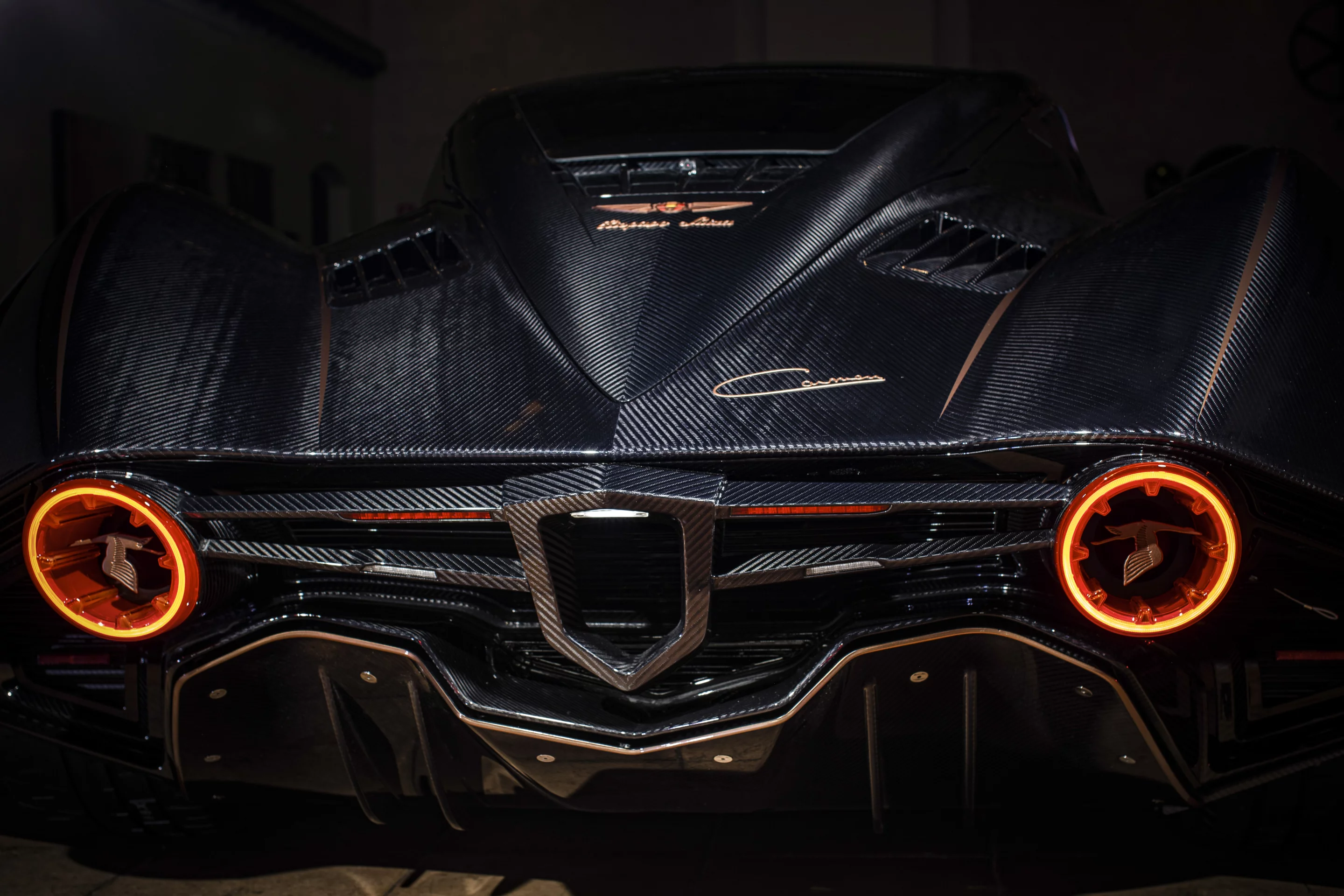 The bright combination tail lamps encircle Hispano Suiza's stork graphic