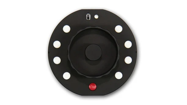 The Okii Systems USB Follow Focus is less than 3 in. (7.6 cm) in diameter, weighs under 5 oz (142 g), and runs on two AAA batteries