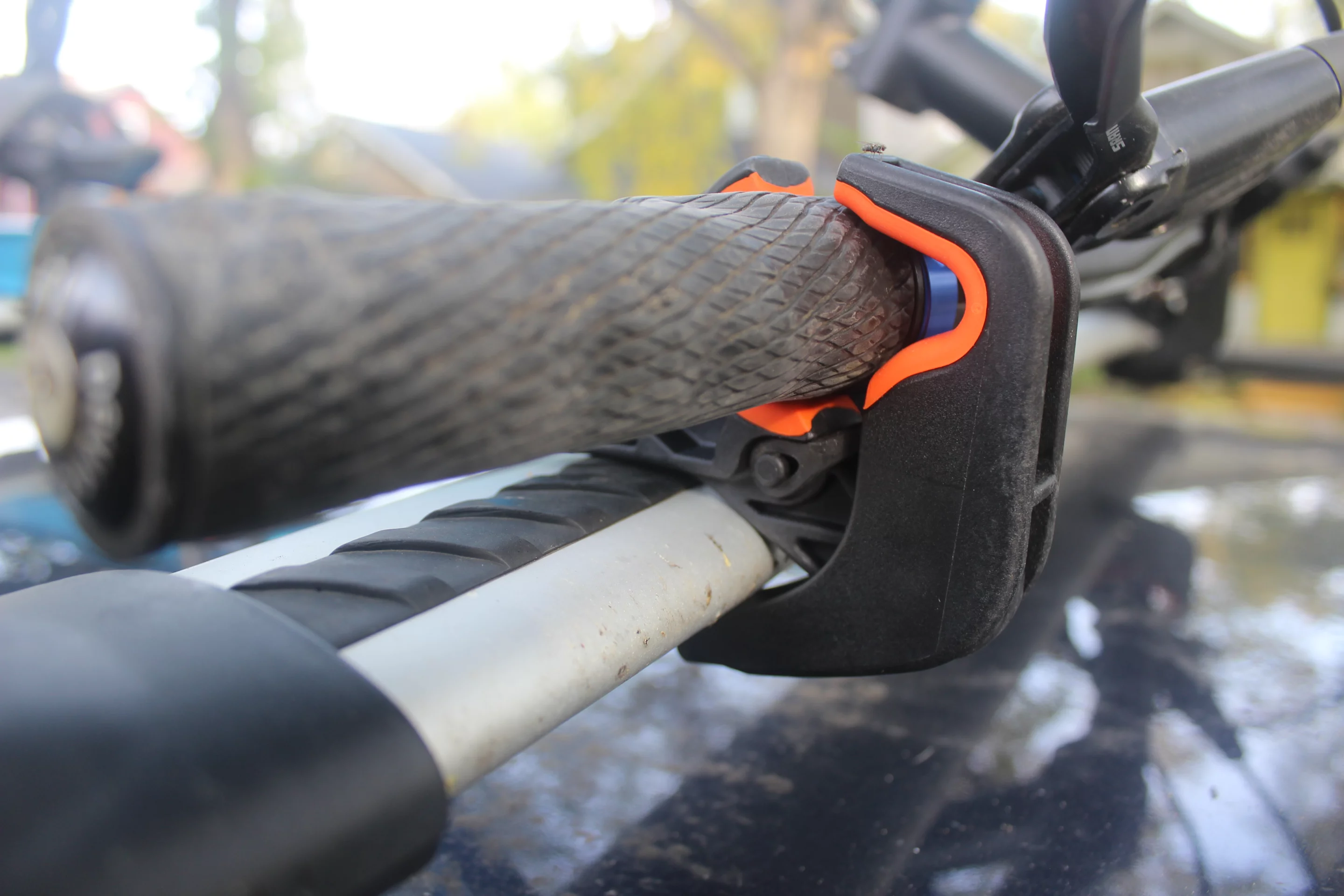 The Upside Rack's handlebar clamps hook onto the car rack's crossbar