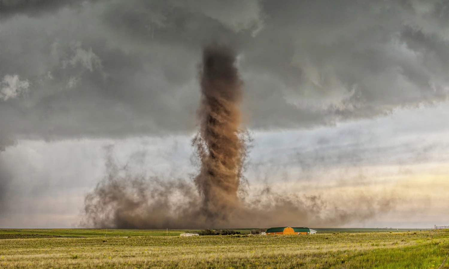 WINNER, BEST SINGLE IMAGE IN A LANDSCAPE & EARTH ELEMENTS PORTFOLIO:James Smart, AustraliaSimla, Colorado, USAThis ‘drill bit’ type of tornado is a rare anti-cyclonic tornado,which happens in around 2% of tornadoes. It touched down in open farmland, narrowly missing a home near Simla, Colorado as it tore up the ground, gathering the soil giving it is brown color.Canon 5D Mark II 70-200mm lens, f4, 1/90 sec, ISO 100