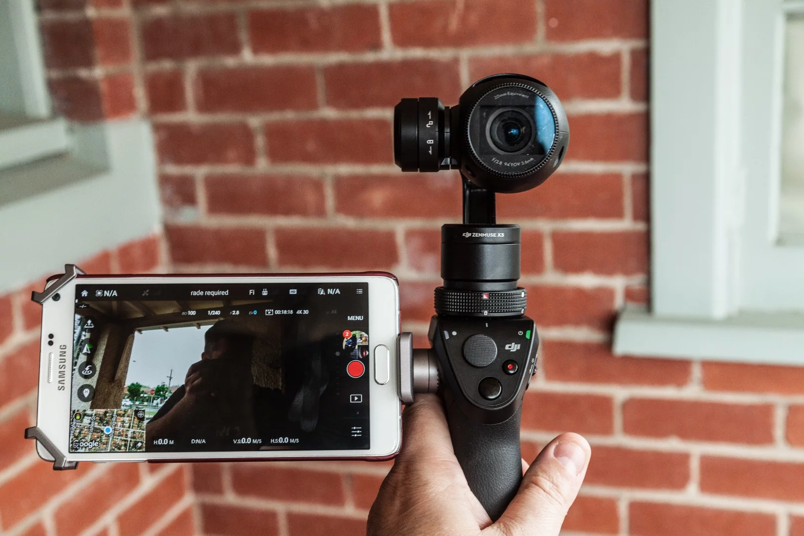 Clicking the trigger on the front three times swivels the Osmo around into "selfie mode" facing the operator