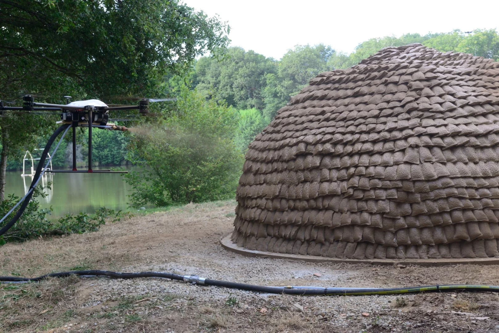 Researchers hope to fit drones with spraying hoses to apply layers of biomaterials onto light structures, such as geodesic dome frames or grid shells covered in tensile fabrics