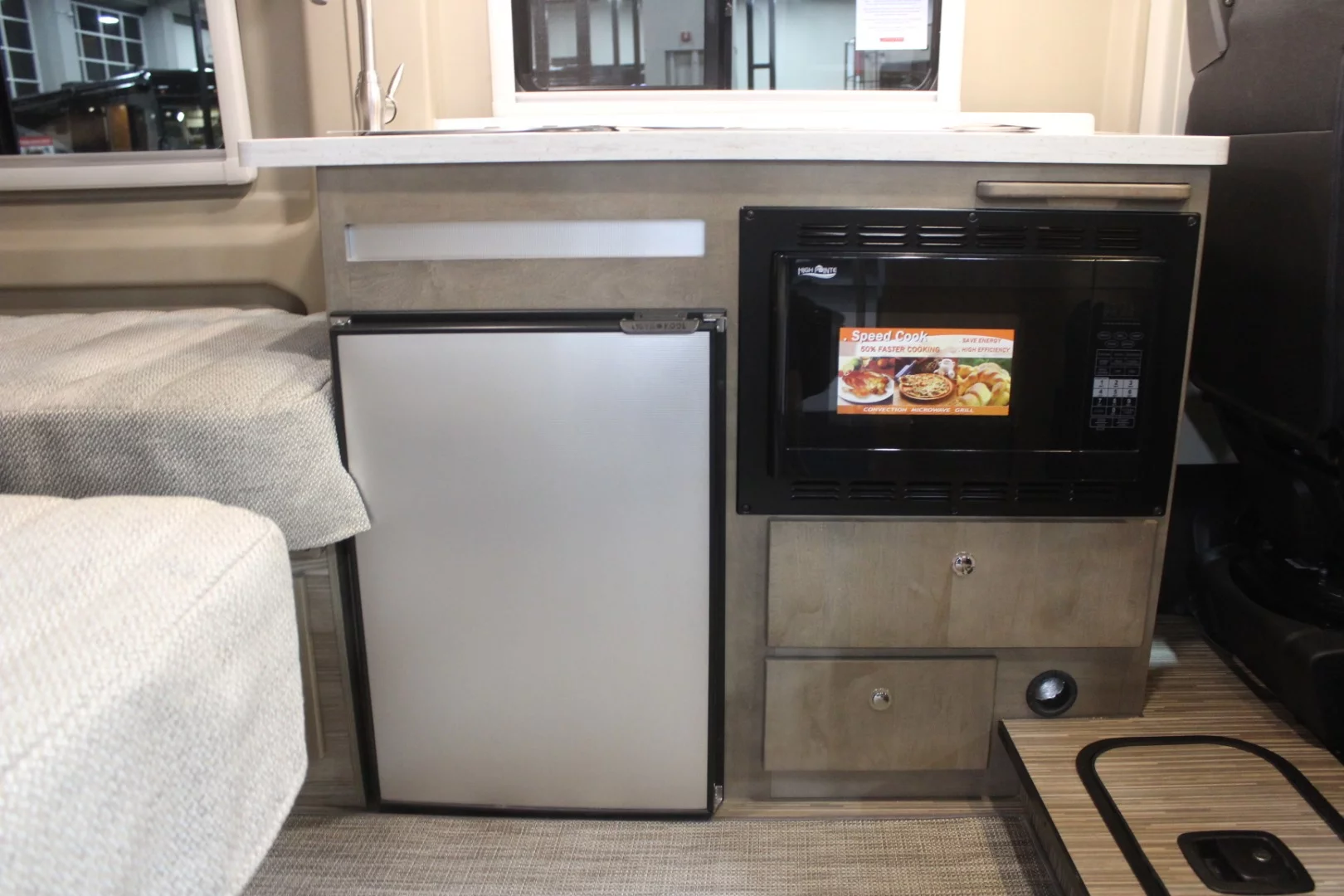 Inside, the Travato has a driver-side kitchen block, dual rear sofa-bed system and rear bath