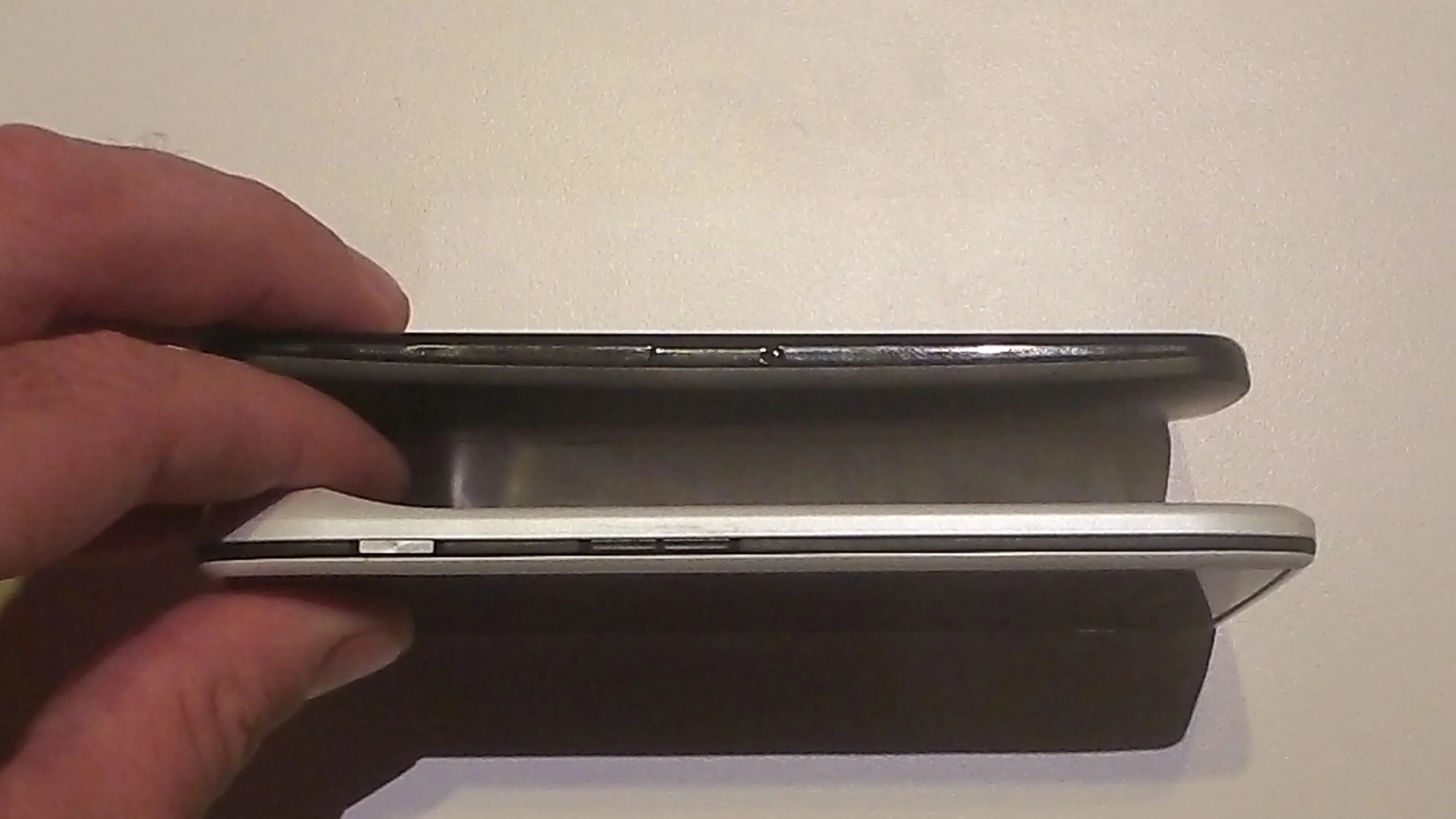 A black Moto X and white Droid Razr from the side