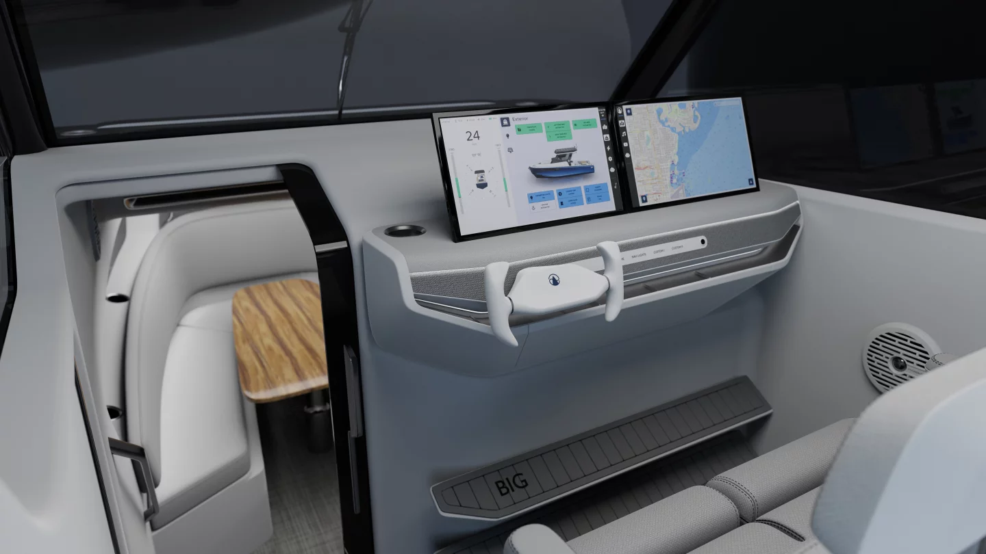 The helm features yoke steering and a dual-screen infotainment system