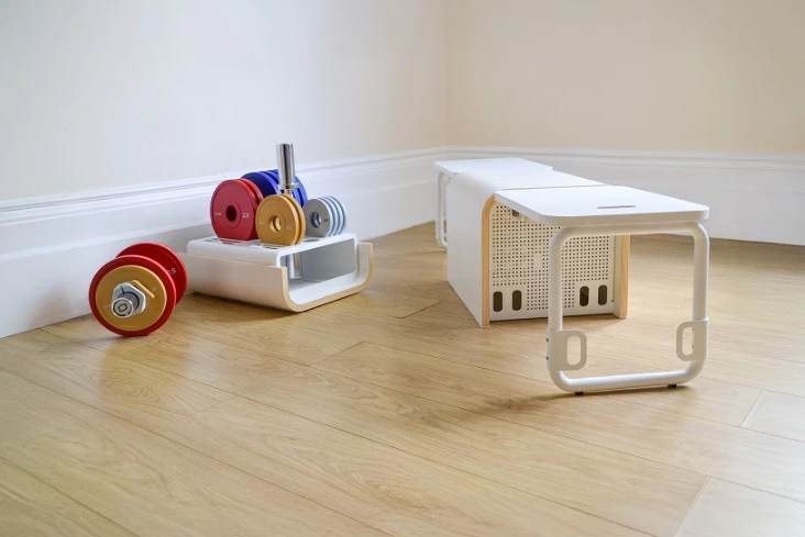 The compact box unfolds into a workout bench