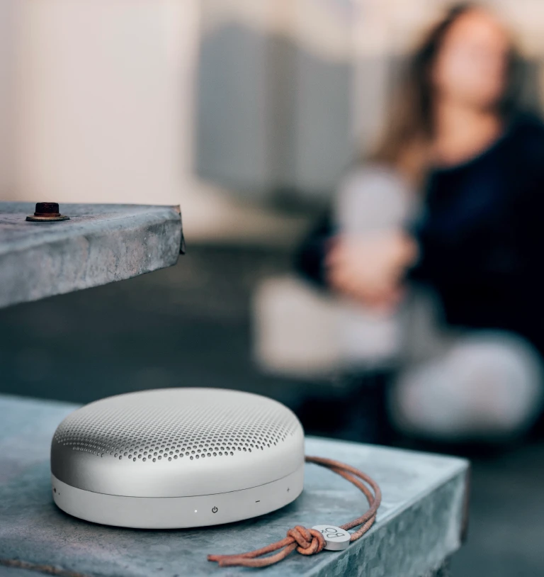 Measuring just 4.8 cm thick and 13.3 cm across, (1.9 and 5.2 in), the disc-shaped BeoPlay A1 isn't much larger than a headphone earpiece
