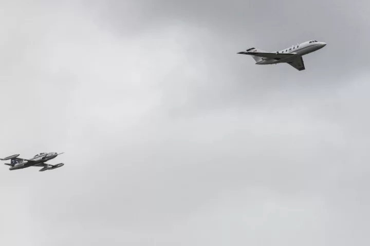 The 100 percent biofuel-powered Falcon 20 being tailed by the data-collecting T-33
