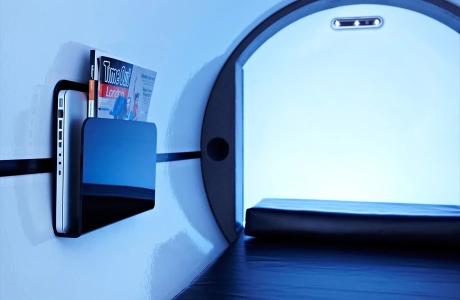 Reading material can be neatly stowed away inside the sleeping pod