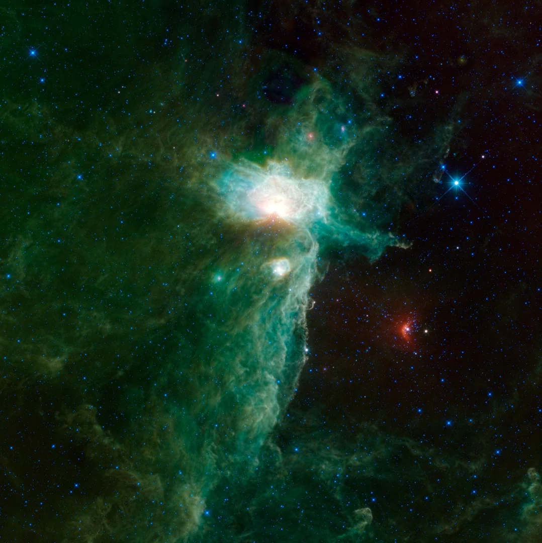 Another view of the Flame Nebula, this time just in infrared. The Flame Nebula is the bright part of the image, and the Horsehead Nebula and NGC 2023 are also visible nearby.