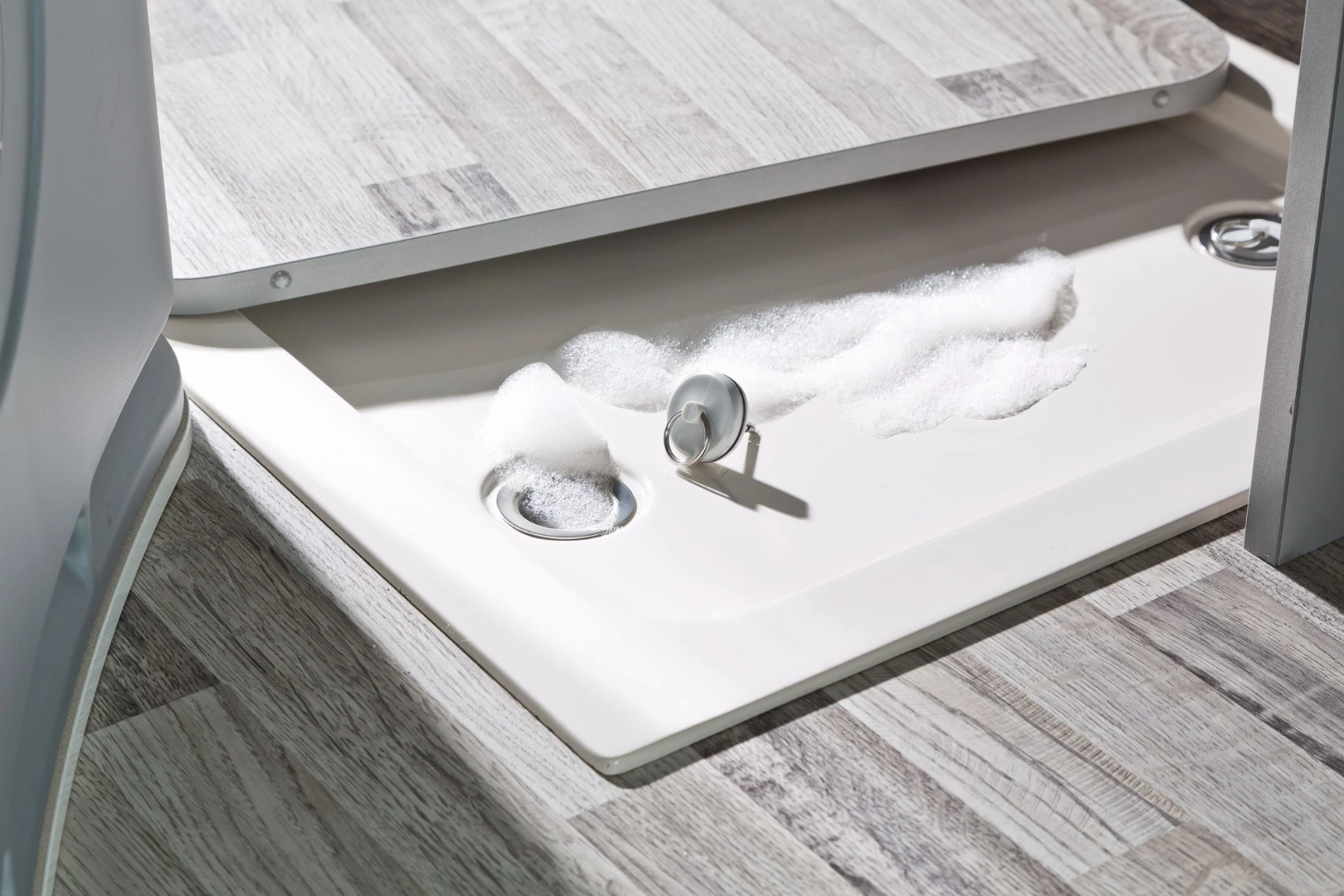 The Club Joker City kitchen floor panel removes to open the shower floor