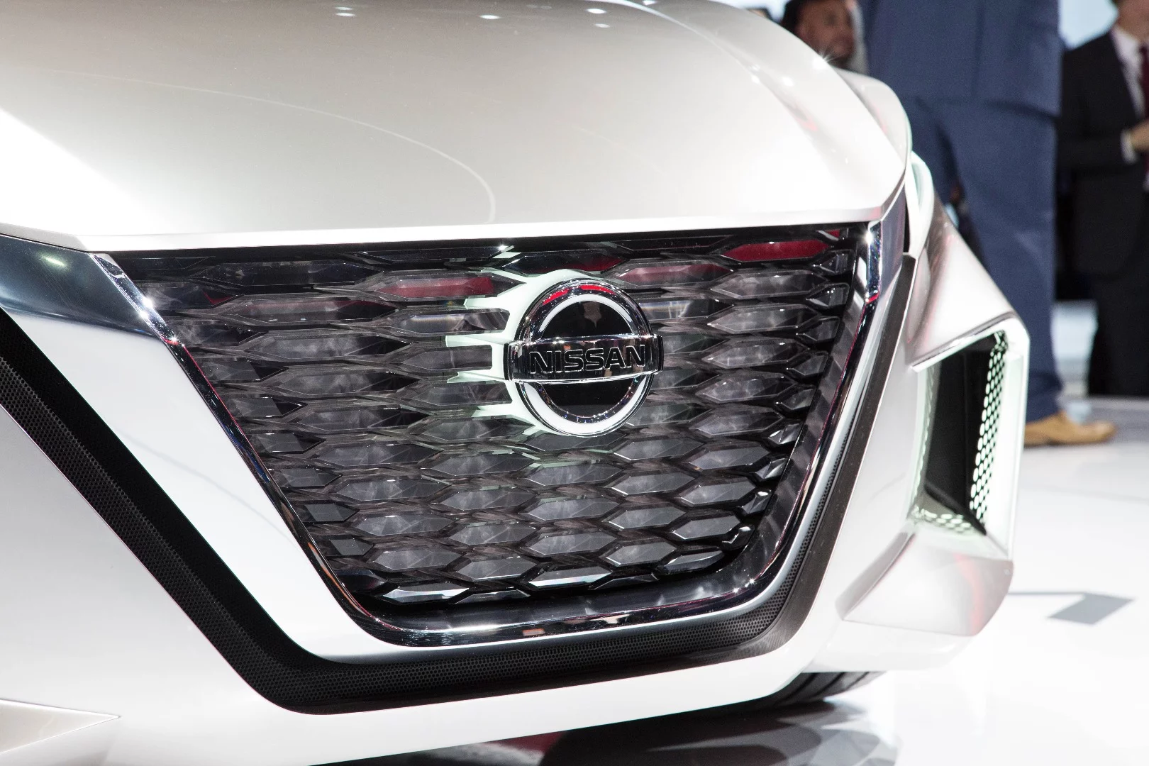 The new Nissan grille takes the current Vmotion design and pushes it further with a few tweaks that accentuate the front end’s futurism