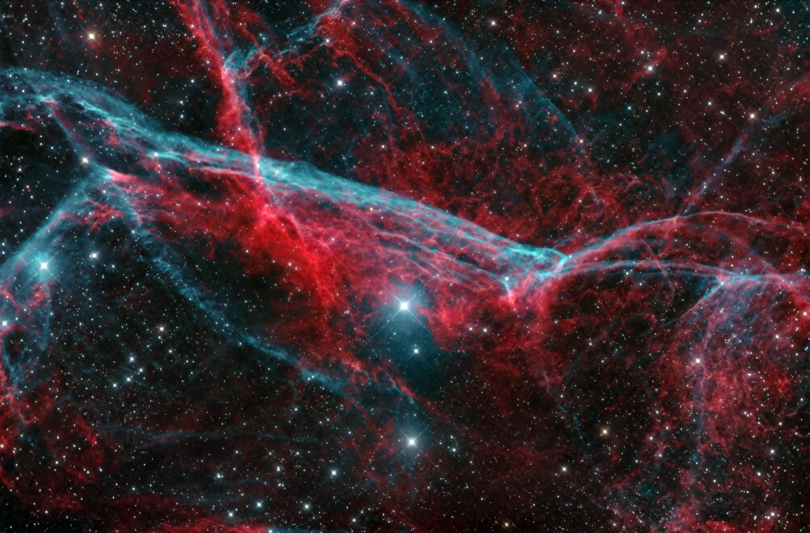 The Gum Nebula or Gum 12 is an emission nebula that extends 36° across the night sky and is actually the very large 12,000-year-old Vela supernova remnant. It mainly consists of red hydrogen and blue doubly ionized oxygen. This is a bi-color image with H-a mapped to red and OIII mapped to both green and blue.Biggera Waters, Australia, 25 February 2018