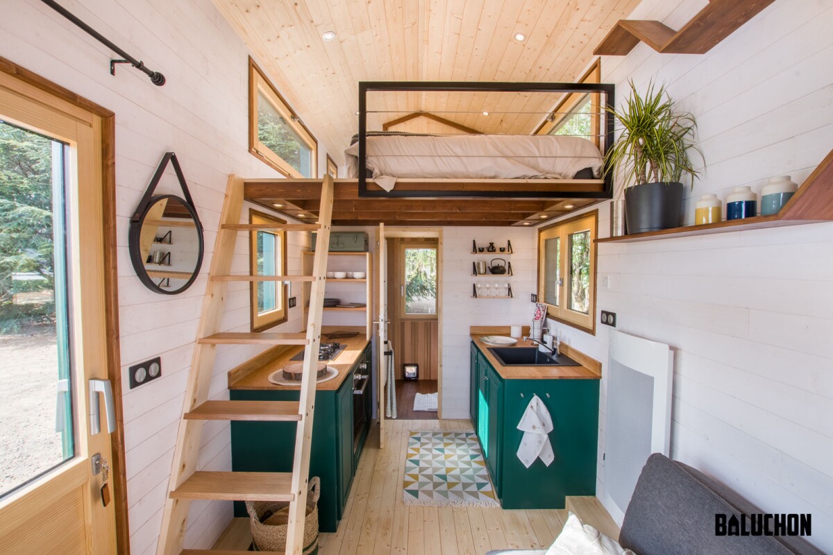The Hauméa tiny house includes a sofa bed on the ground floor and both a double bed and a single bed upstairs