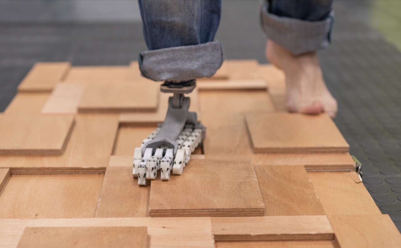 A volunteer puts the SoftFoot Pro to the test on an uneven walking surface