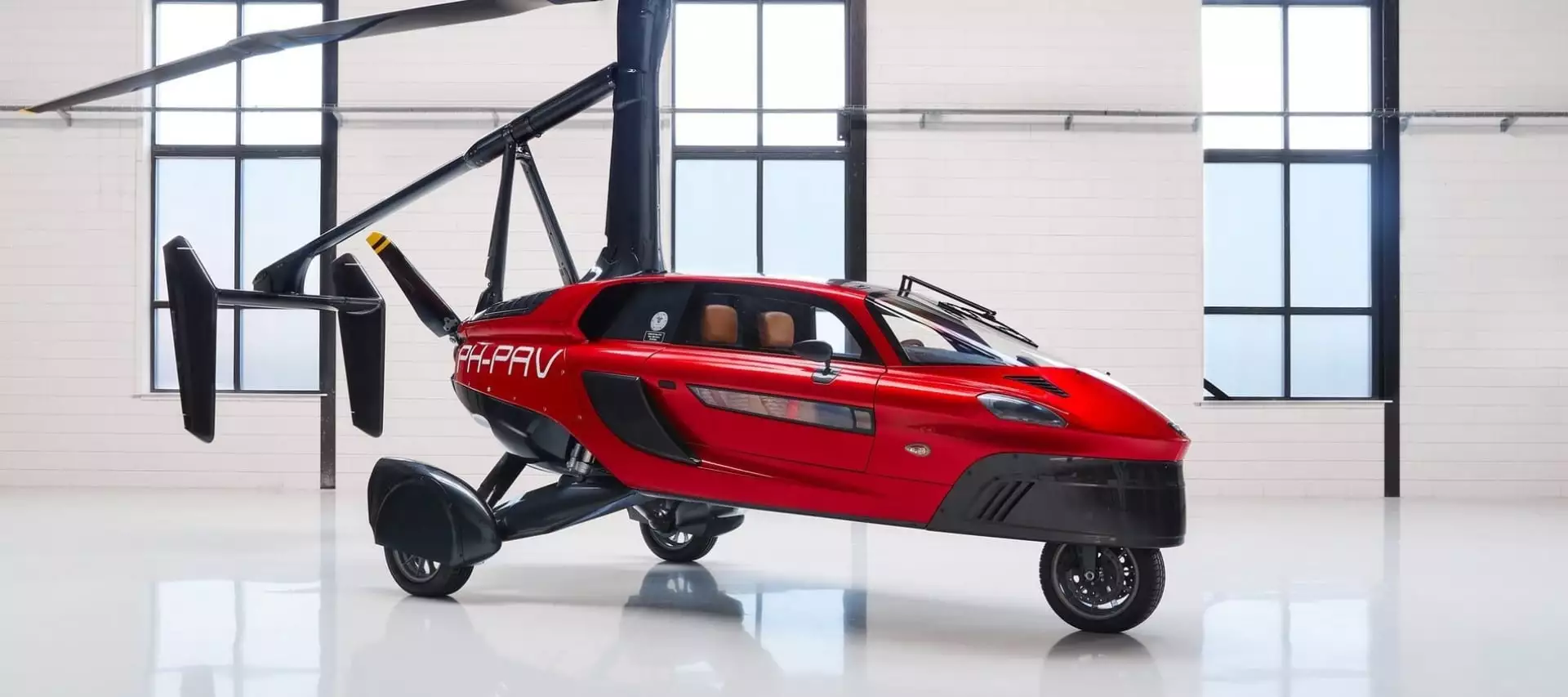 Fully folded out, the Liberty is a three-wheel gyroplane running on a rear pusher prop