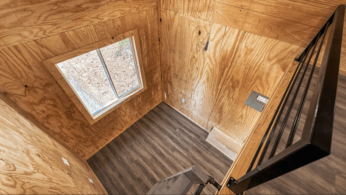 The Element 20's interior features a living room with enough space for a sofa