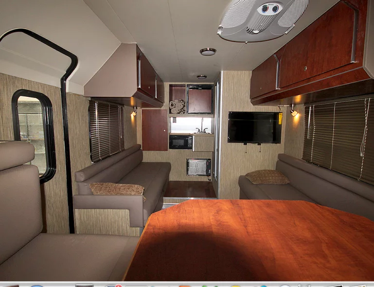 Dual sofas and a dining area make the ADAK feel more spacious than other trailers