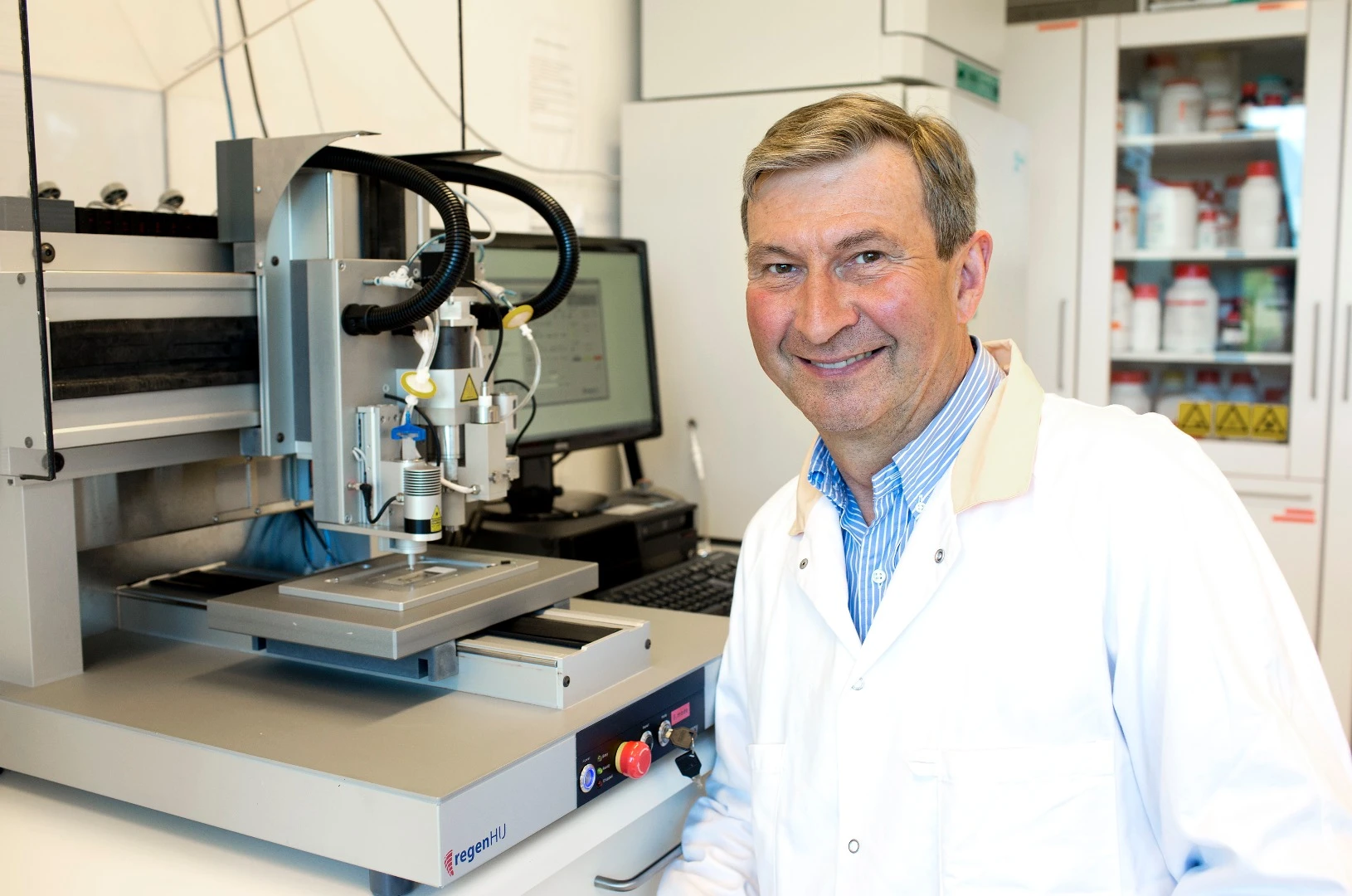 Lead researcher Paul Gatenholm stands beside the 3D bioprinter used to print the nanocellulose structures