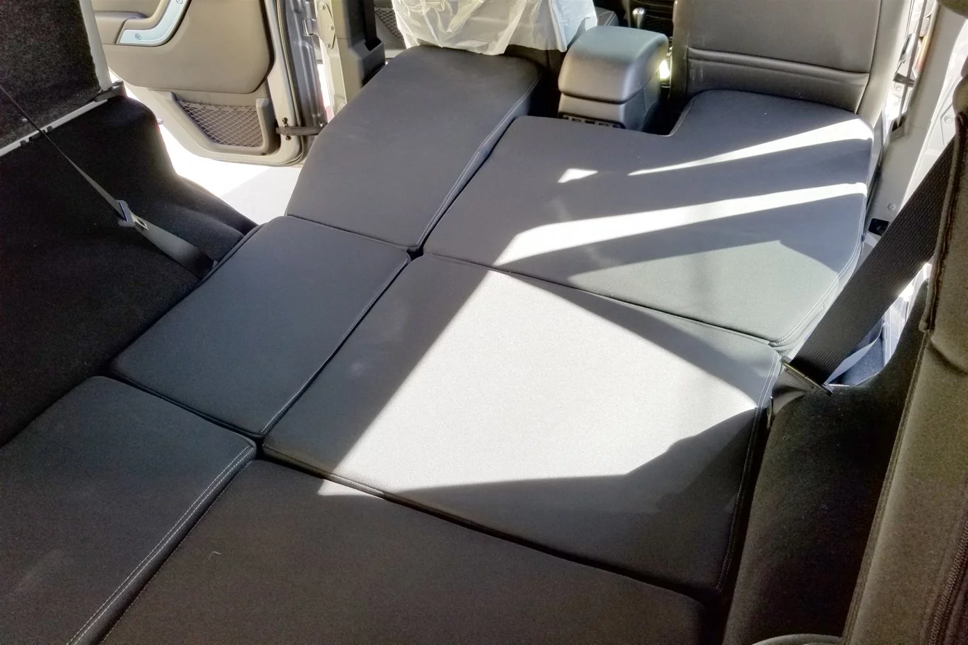 The original X4, the design and molds of which Two Track purchased from Action Camper, features a pass-through to the cab complete with a lower double bed that rests partly atop the folded rear seats