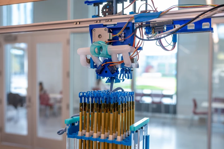 At the heart of the machine is a 6 x 6 block of double-hooked knitting needles