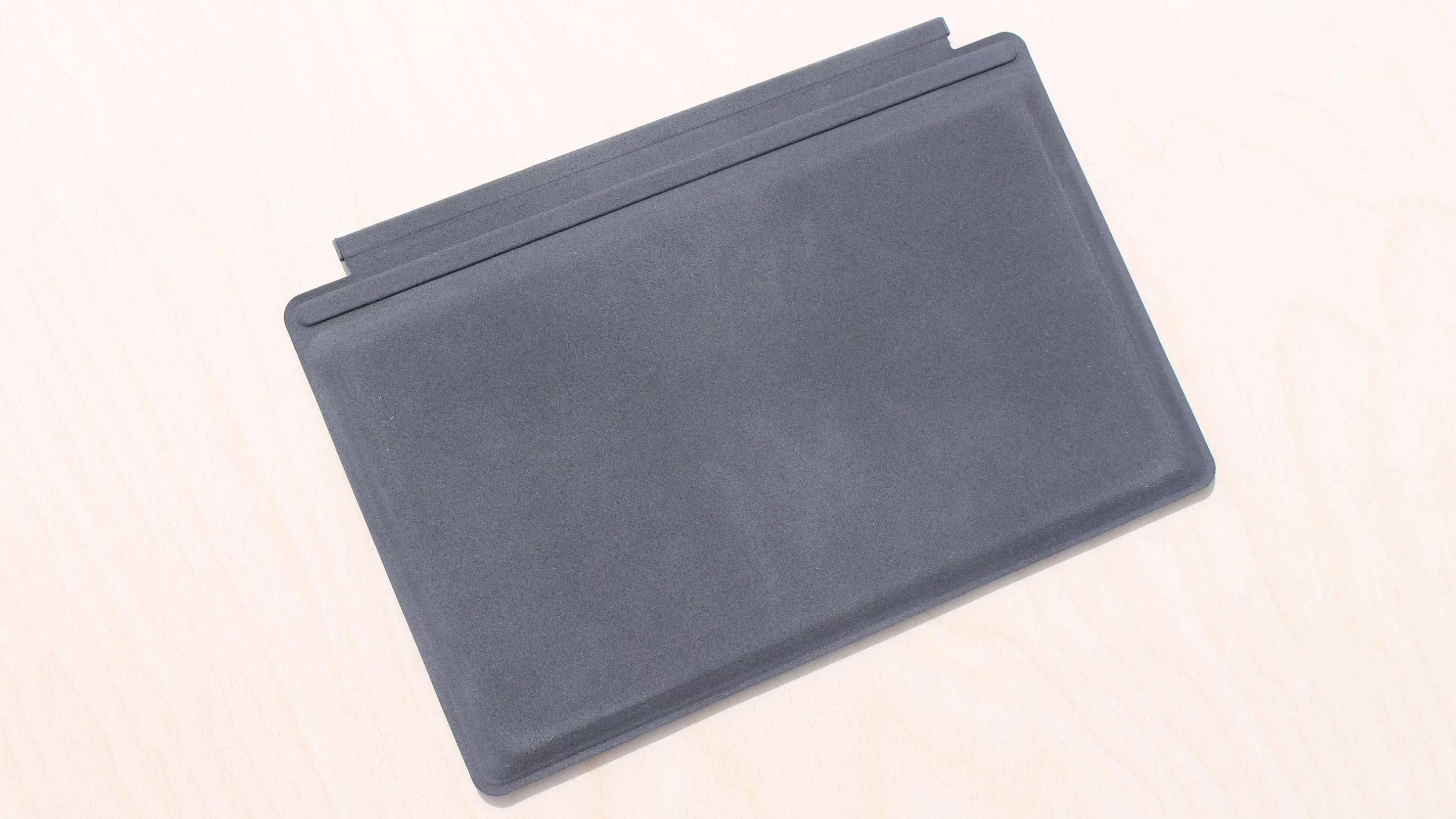 The Power Cover has a soft felt-ish material on its back