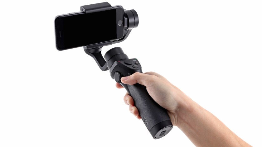 The Osmo Mobile works much like its predecessor, with the exception that it utilizes the user's own Bluetooth-connected Apple or Android smartphone instead of a DJI-supplied drone camera