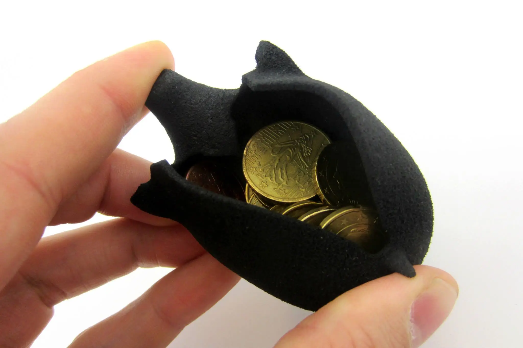 A flexible piggy bank doubles as a coin purse