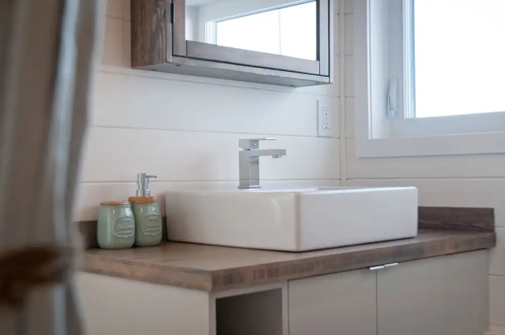 The Sakura's bathroom includes a full-size bathtub/shower, sink, and a composting toilet