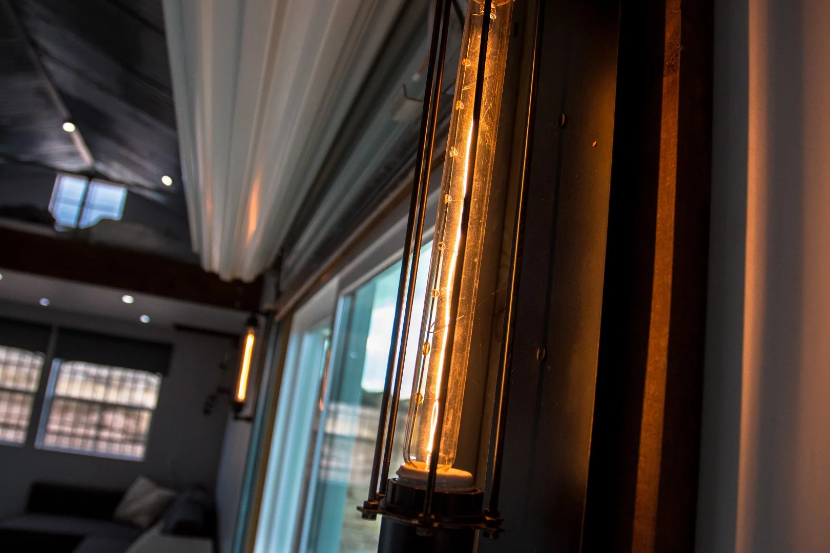 "Energy is at a premium when you're off grid, but sometimes you have to have style." That was Chris' justification for having a pair of 60 watt edison lights.