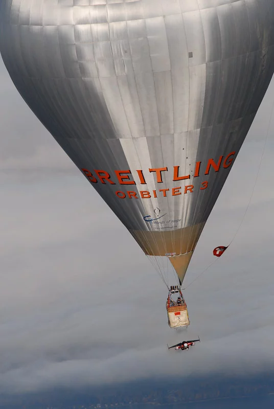 Swiss 'Jetman' Yves Rossy has successfully performed two aerial loops, using his unique strap-on jet-powered wing