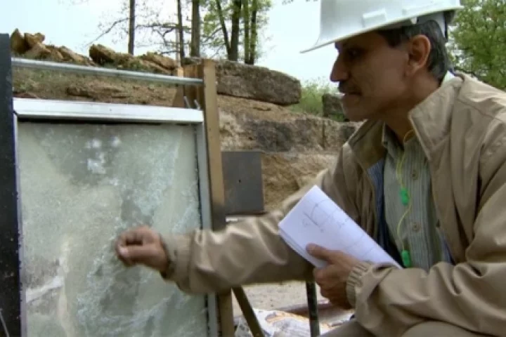 Sanjeev Khanna, associate professor of mechanical and aerospace engineering in the MU College of Engineering inspects the blast-resistant glass
