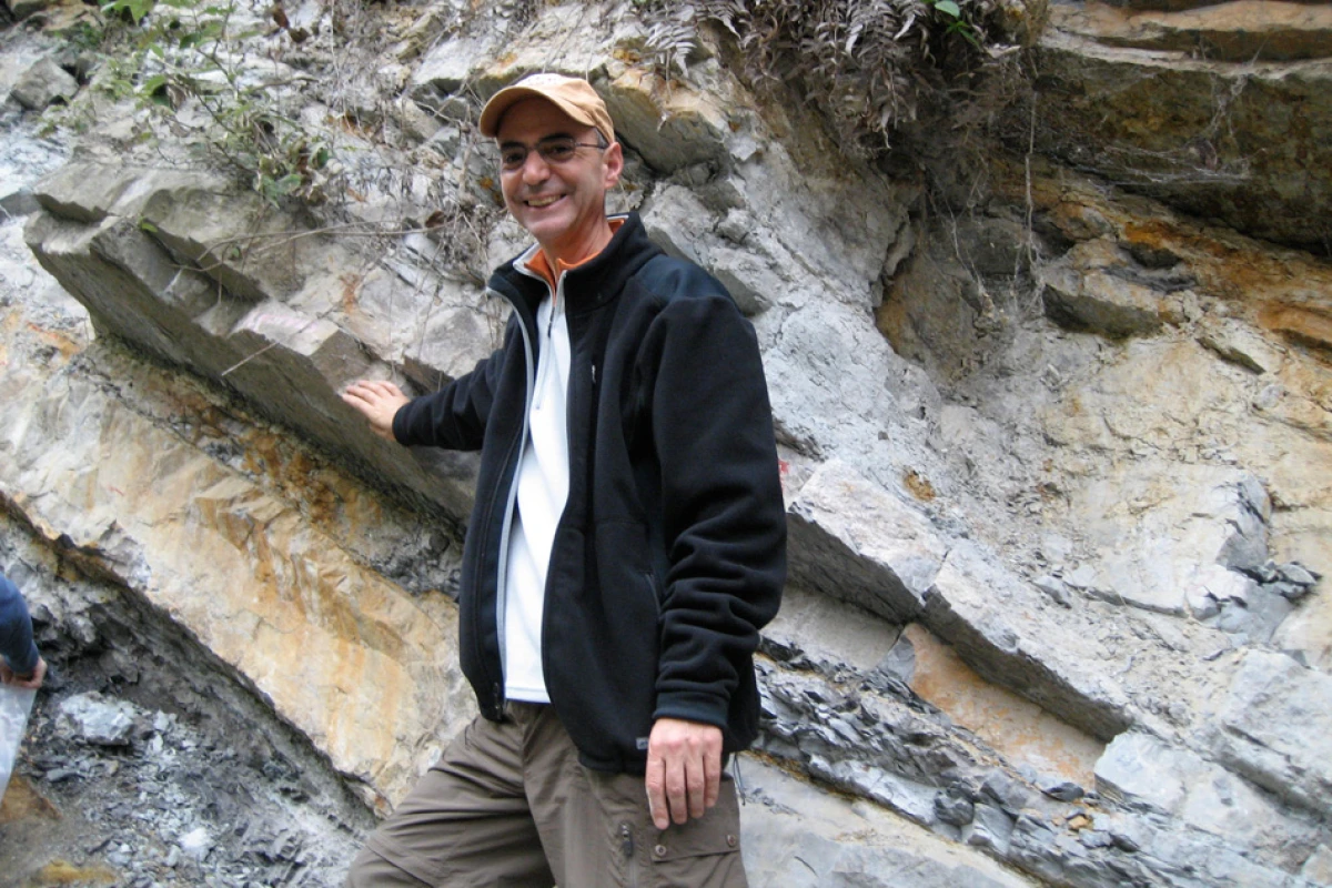 MIT professor of geophysics Daniel Rothman stands next to part of the Xiakou formation in China (Photo: Daniel Rothman)
