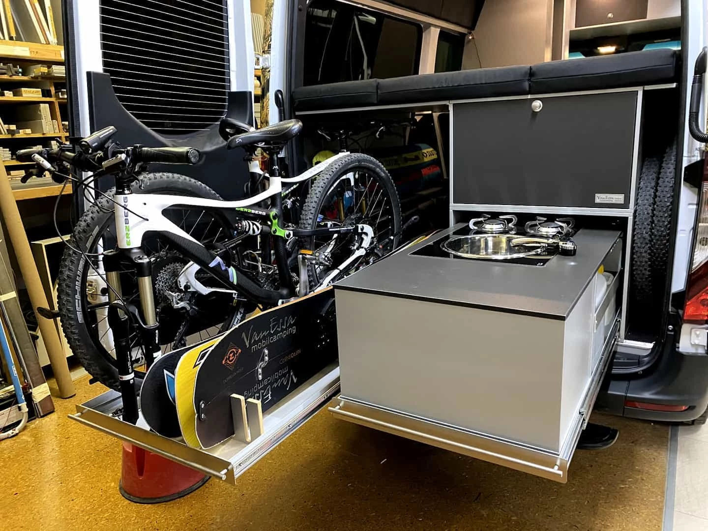 A multi-season, multi-sport set-up in back of the VanEssa show Sprinter