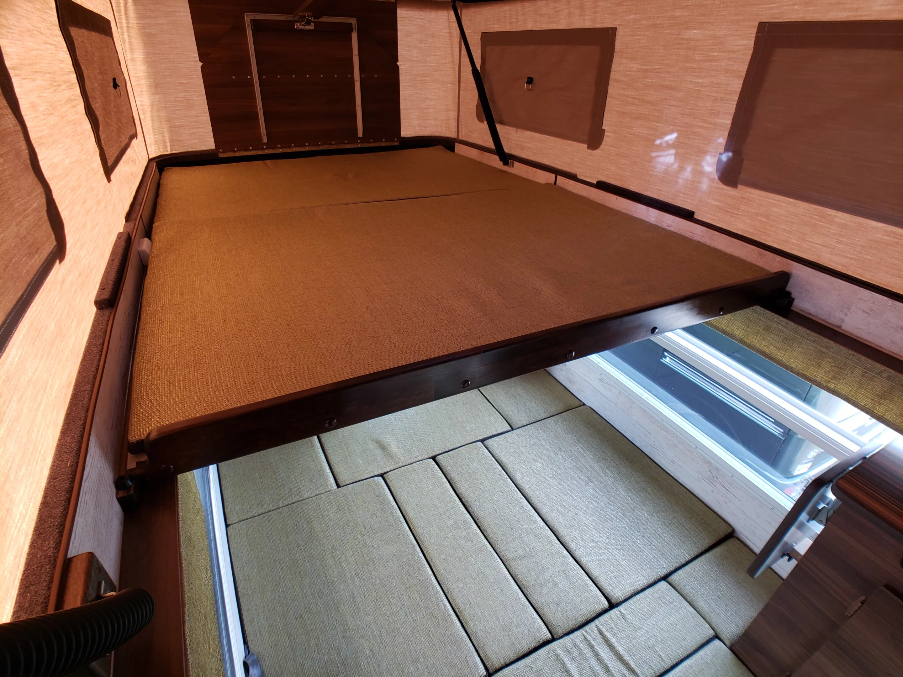 The lower and upper beds combine into a pair of bunks that sleep four people