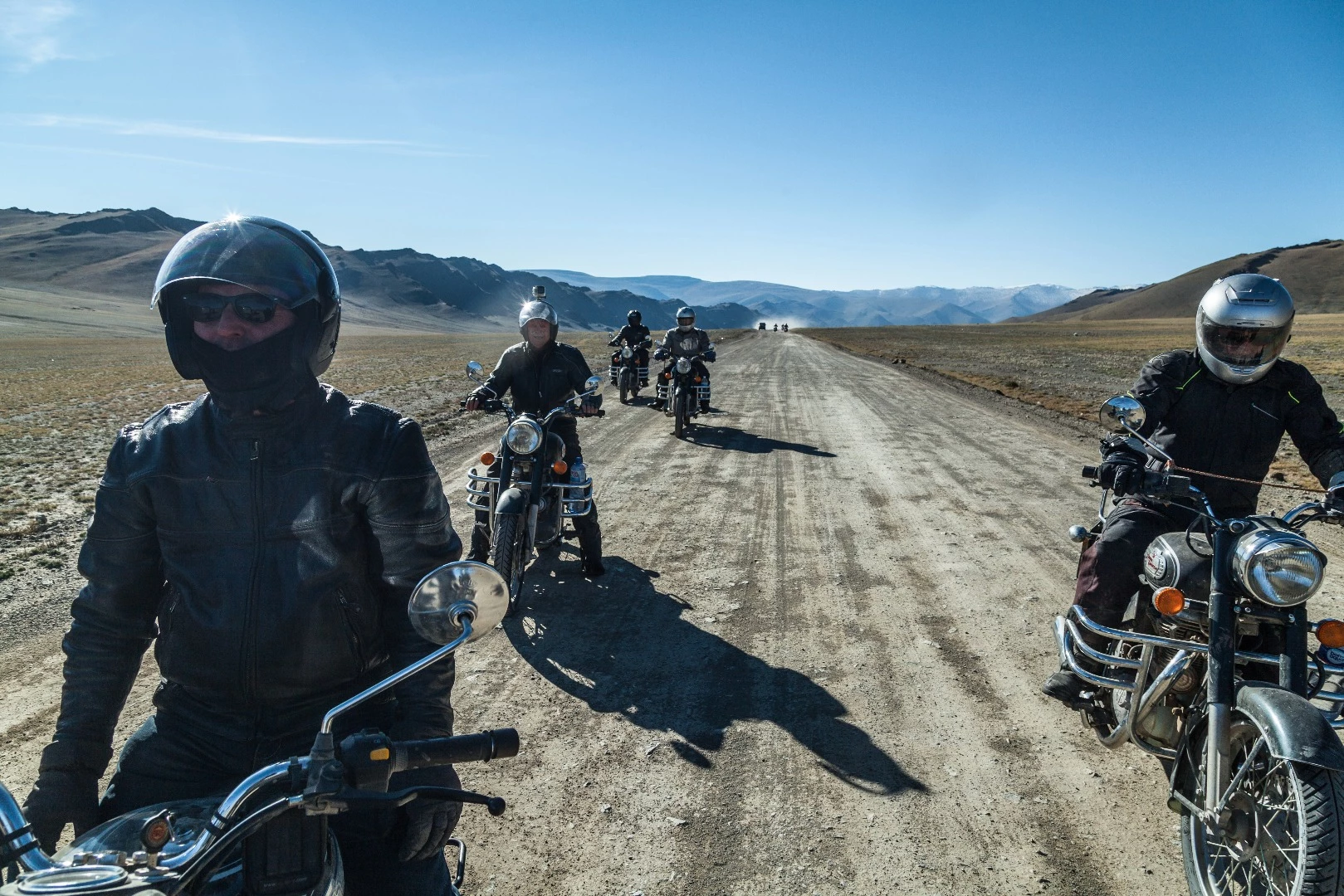 The group rests on one of the better roads we see