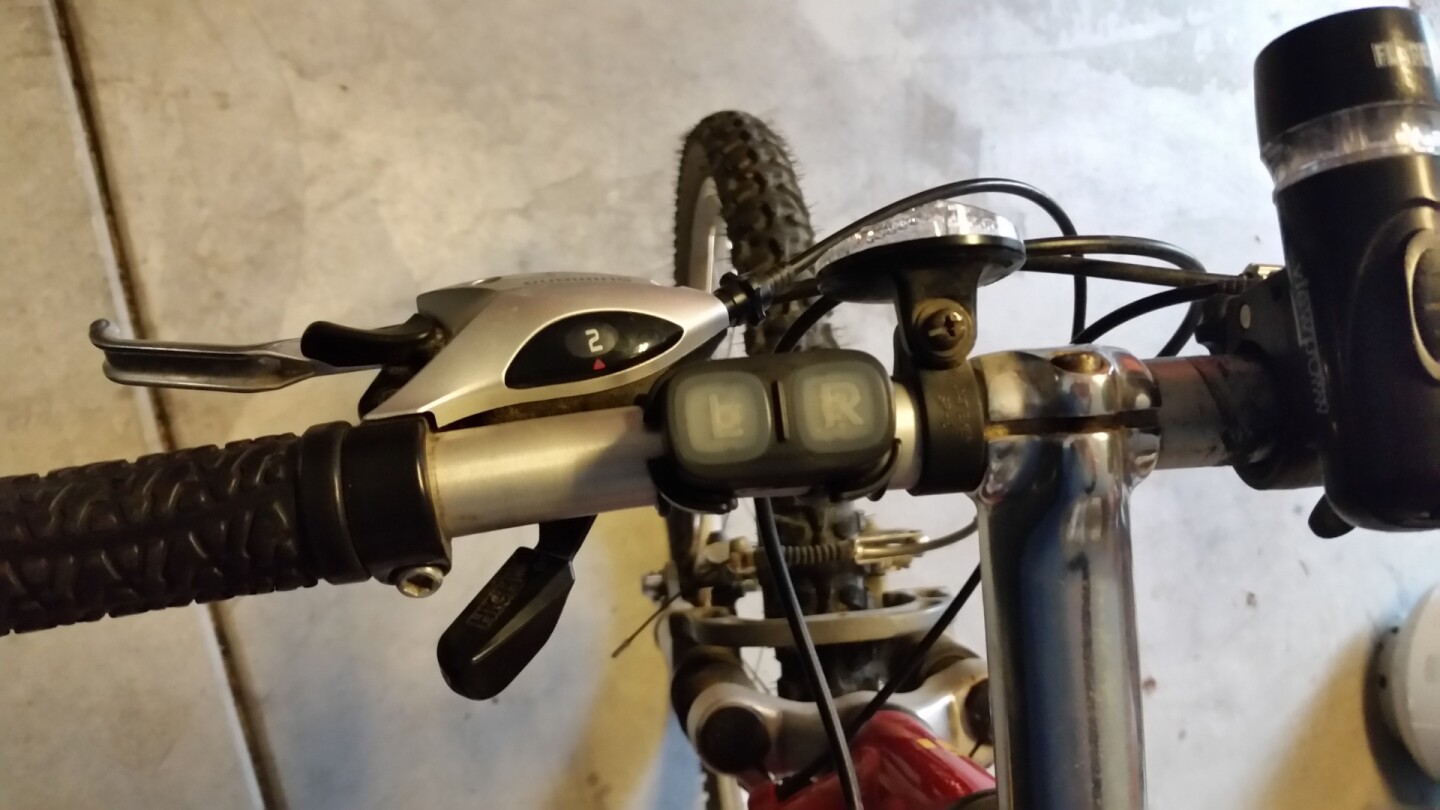 The remote turn signal module syncs with your helmet via a Bluetooth connection