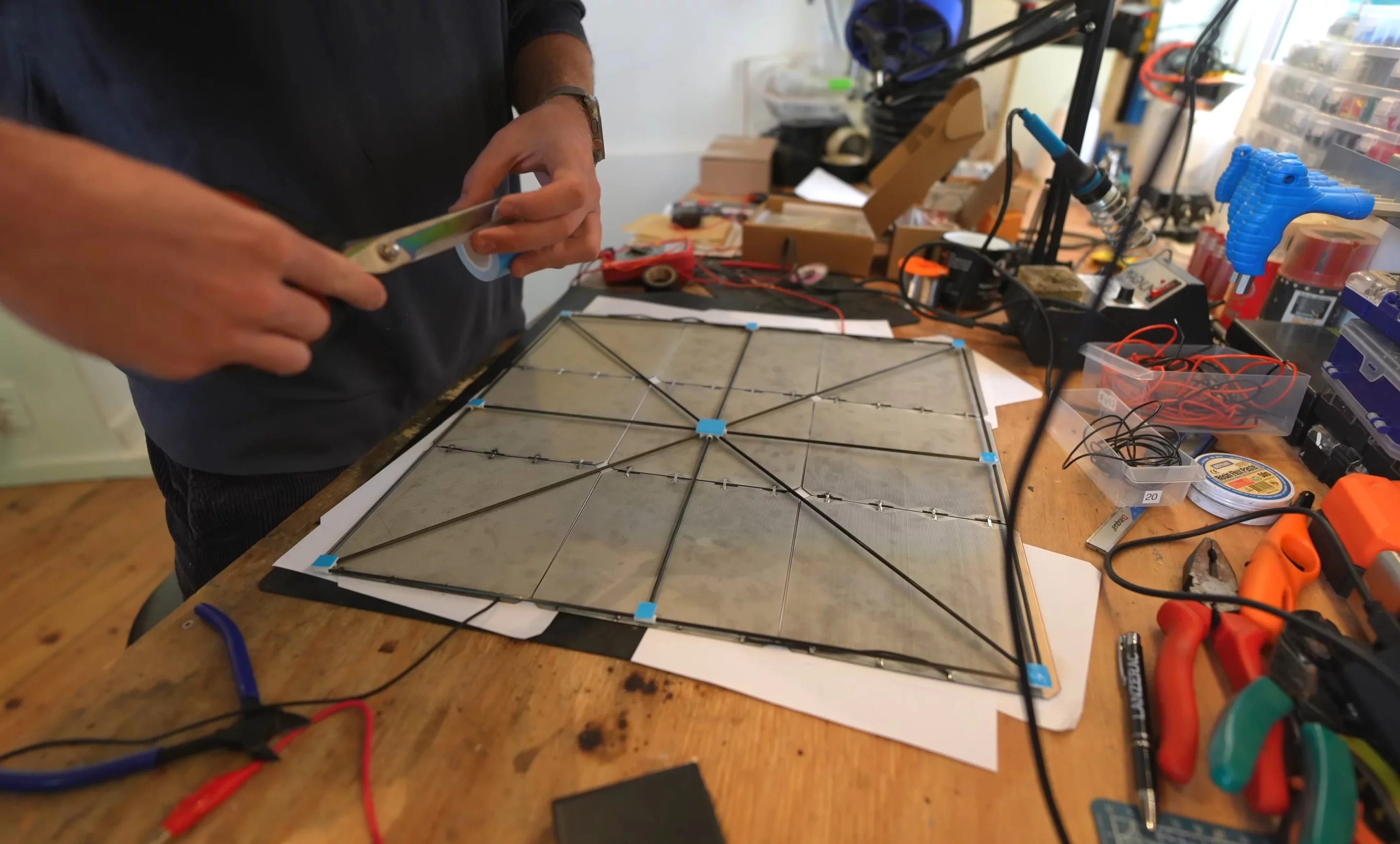 Three sets of nine solar cells are connected in series and mounted to the drone's X-frame