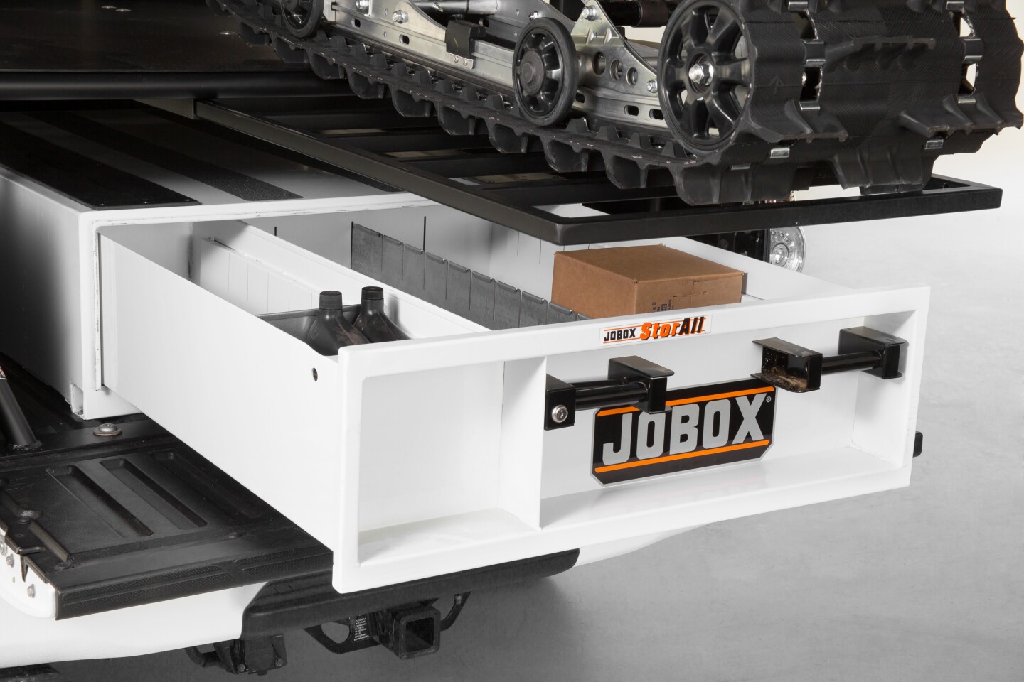 The storage drawer under the carrier deck keeps tools and gear organized